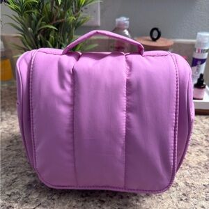 Calpak Luka hanging toiletry bag bubblegum pink